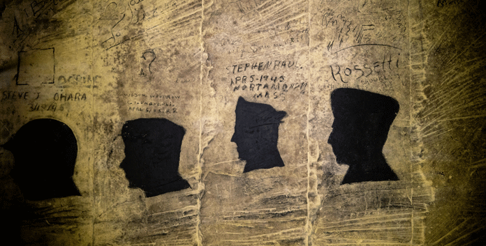 Silhouetten van Amerikaanse bevrijders in de Fluweelengrot © Fluweelengrot